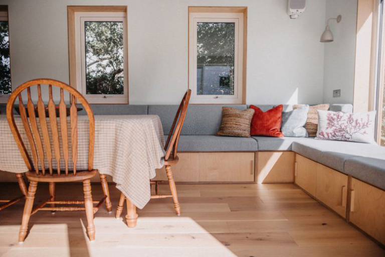 long lounging area with wooden floors