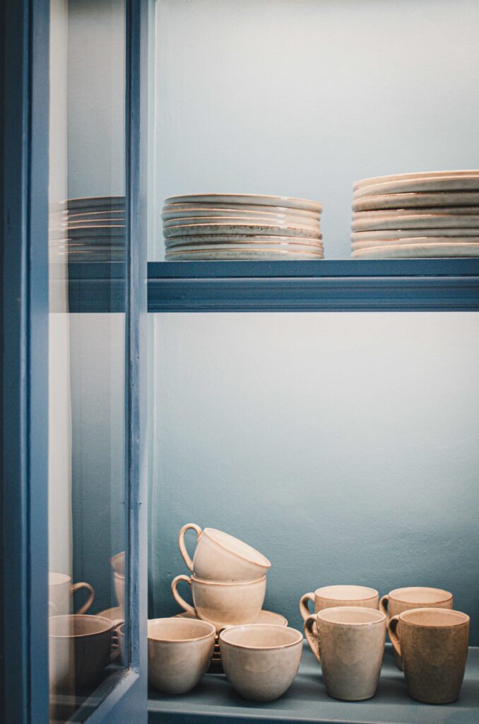 B Corp crockery in display cabinet.