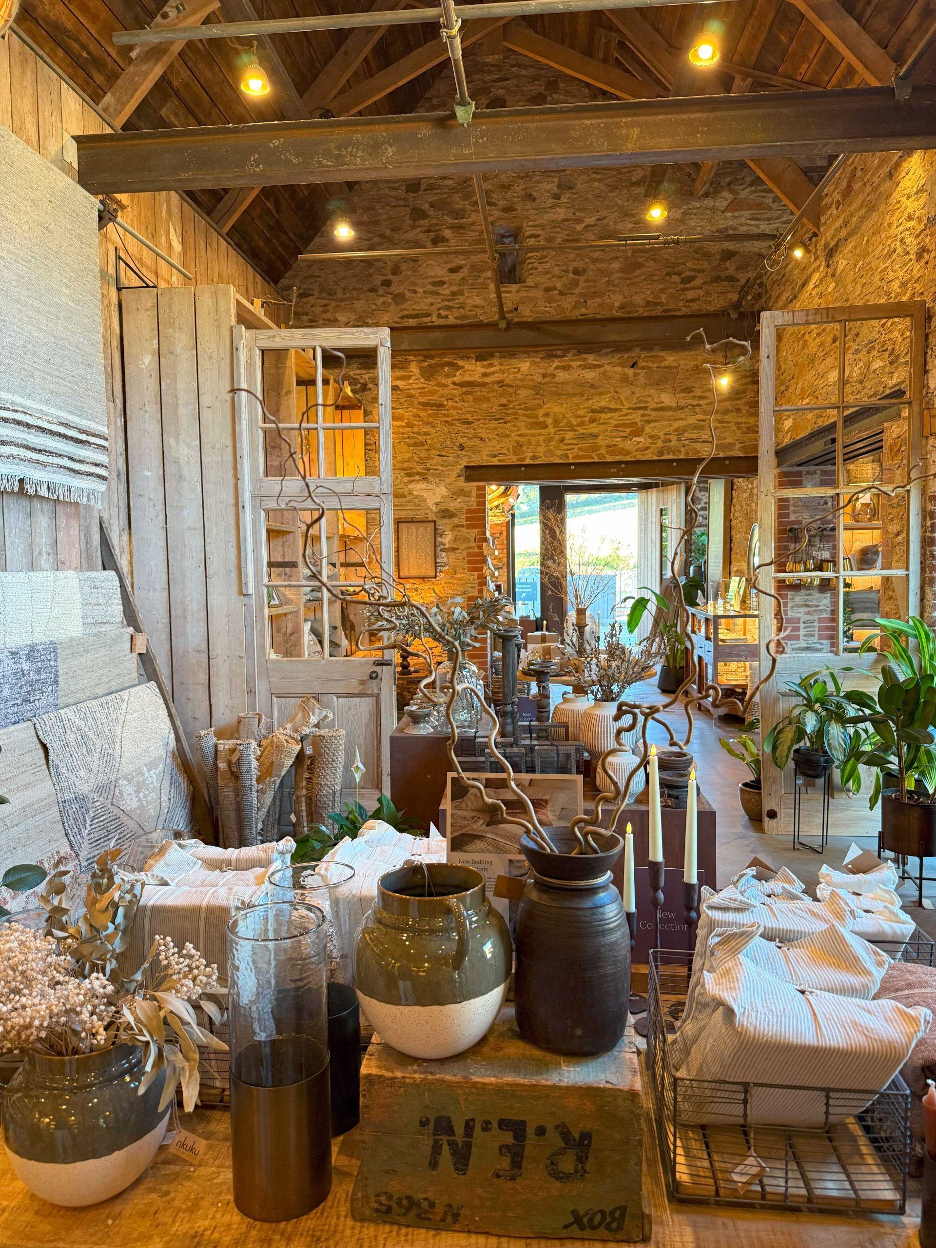 Inside a barn, Nkuku's products are on display