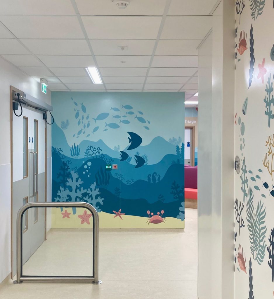 Under the sea graphics mural in corridor