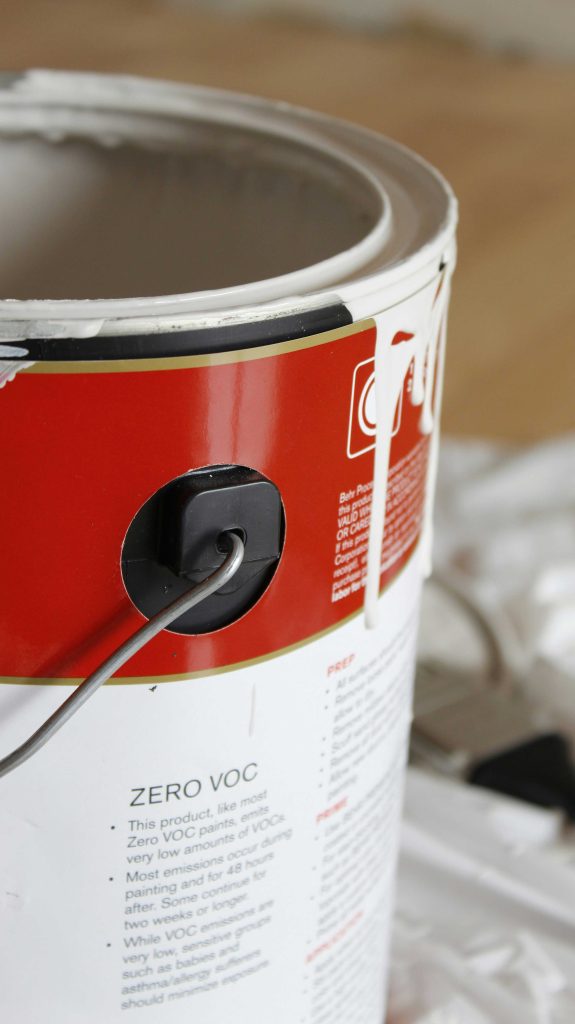 A closeup of a paint tin reading low voc
